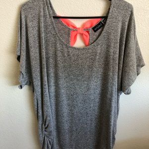 Neon pink bow back top